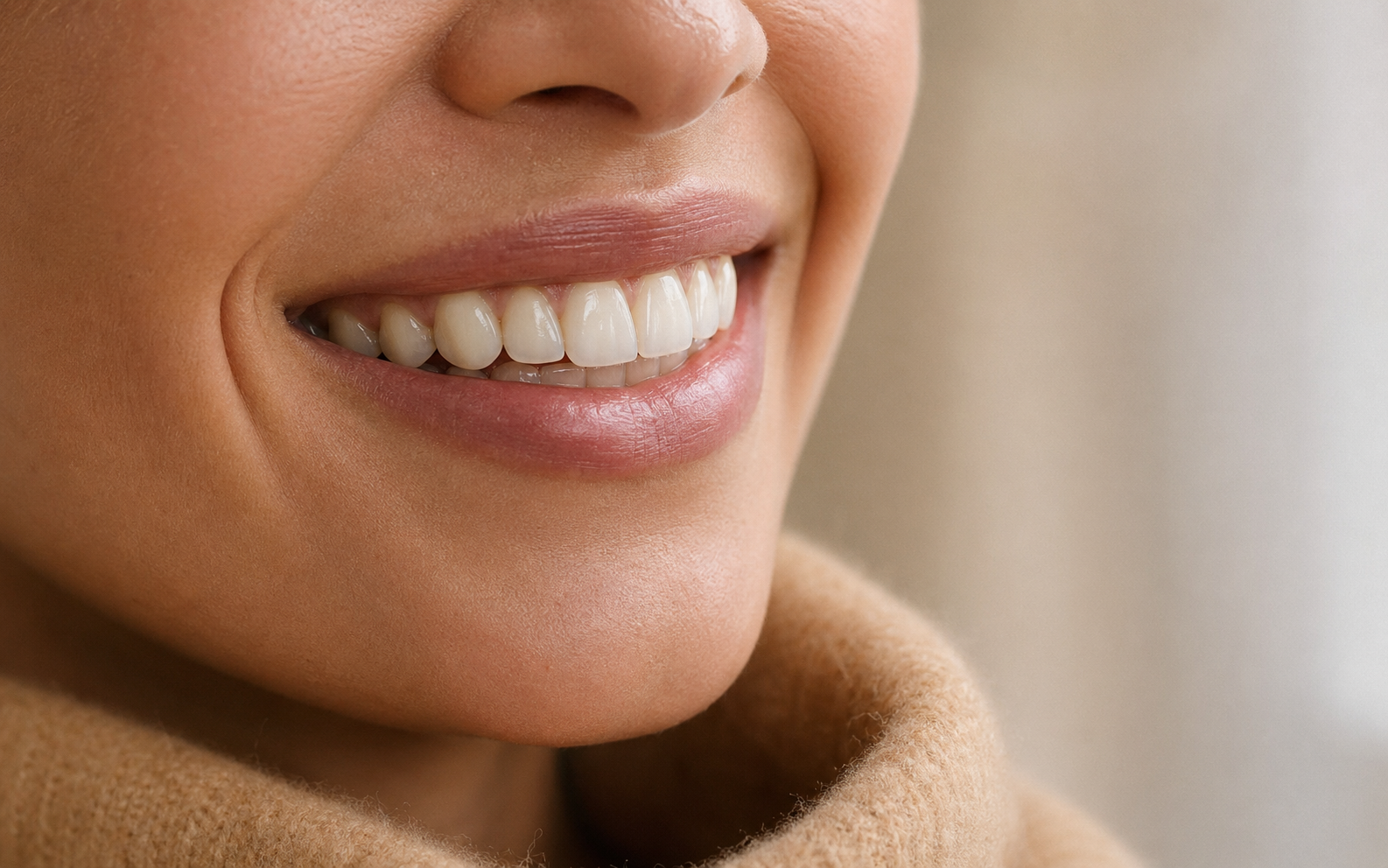 Editorial close-up of a refined cosmetic-dentistry smile.