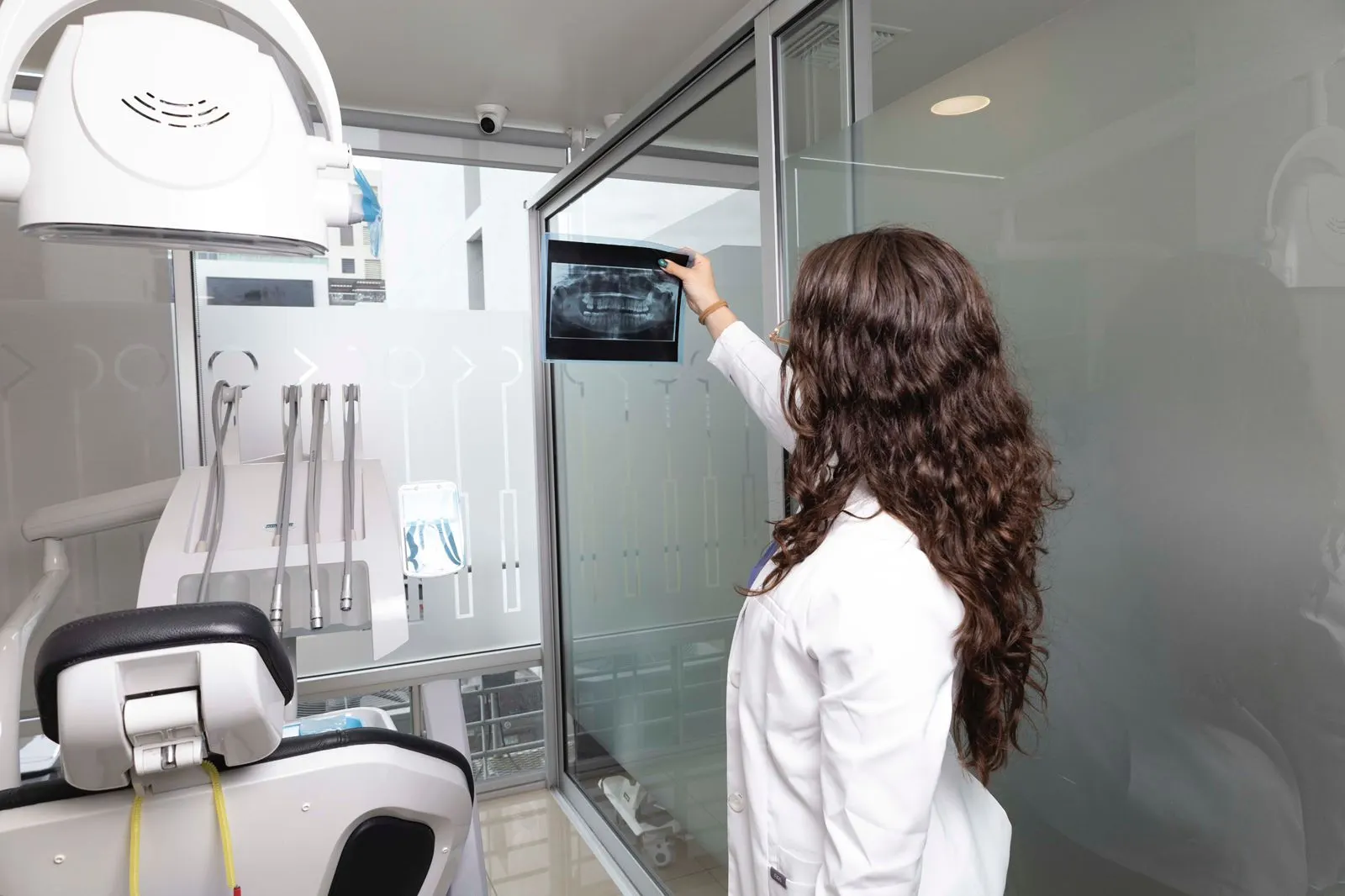 A Dental Team 1 member reviewing a panoramic dental X-ray for treatment planning