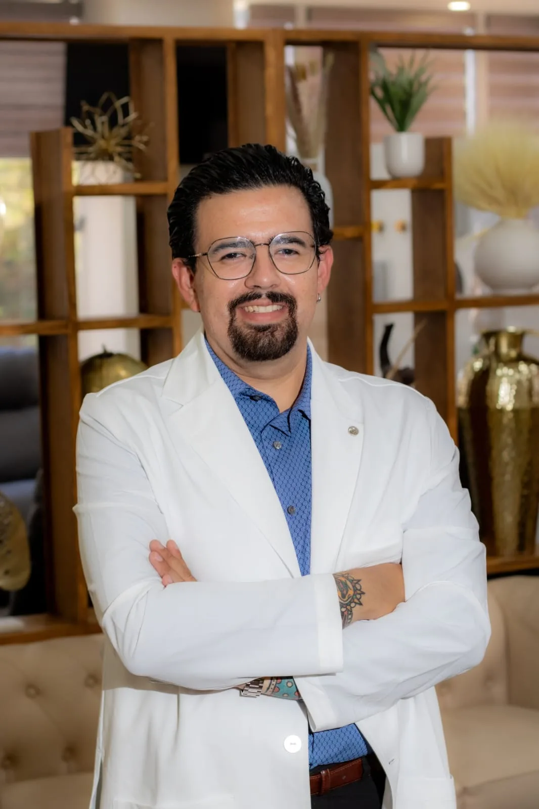 Dr. Eduardo Moreno, Hair Transplant Specialist at Allure RT MX, in a white coat at the clinic