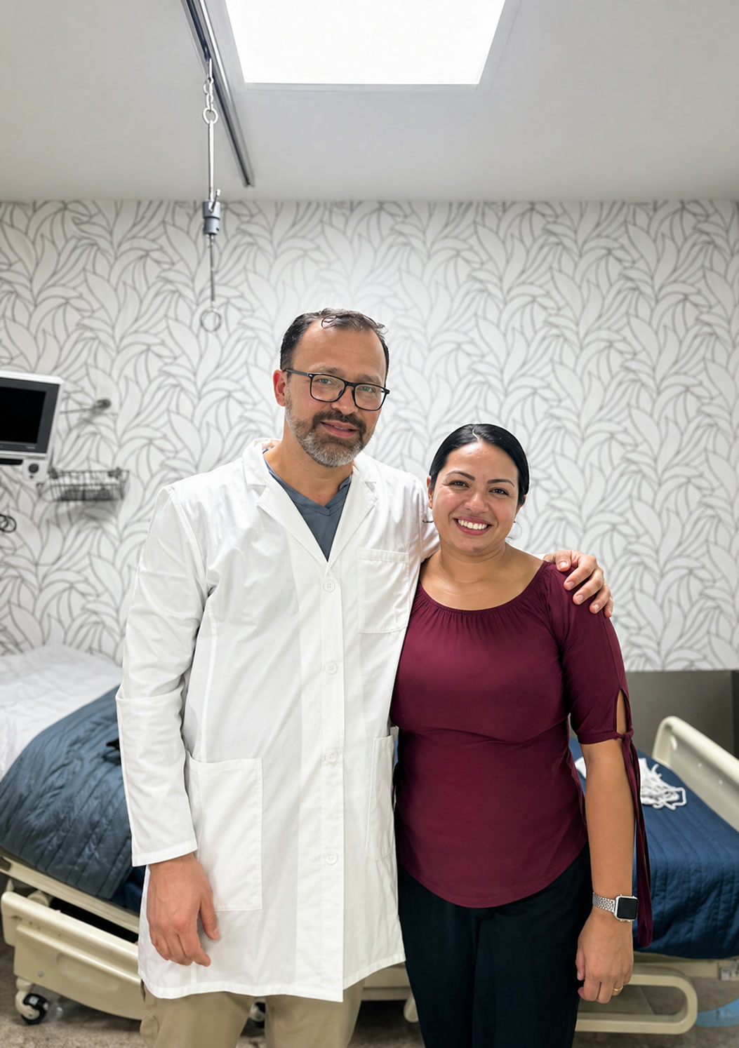 Dr. Marcos Casta&ntilde;eda with a patient at the partner clinic, post-treatment