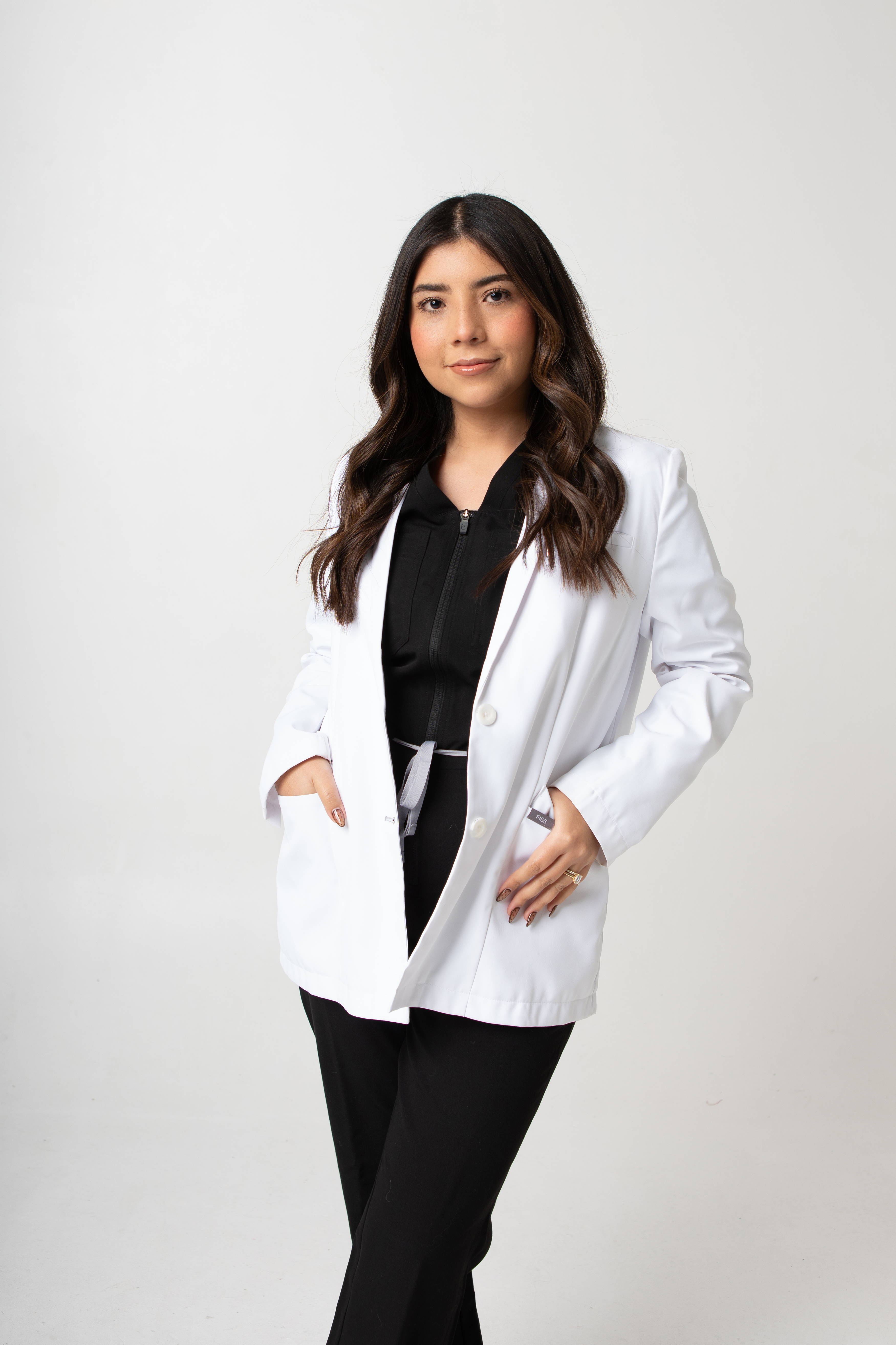 Dr. Lucy, Allure Dental cosmetic specialist, clinical portrait in a white lab coat