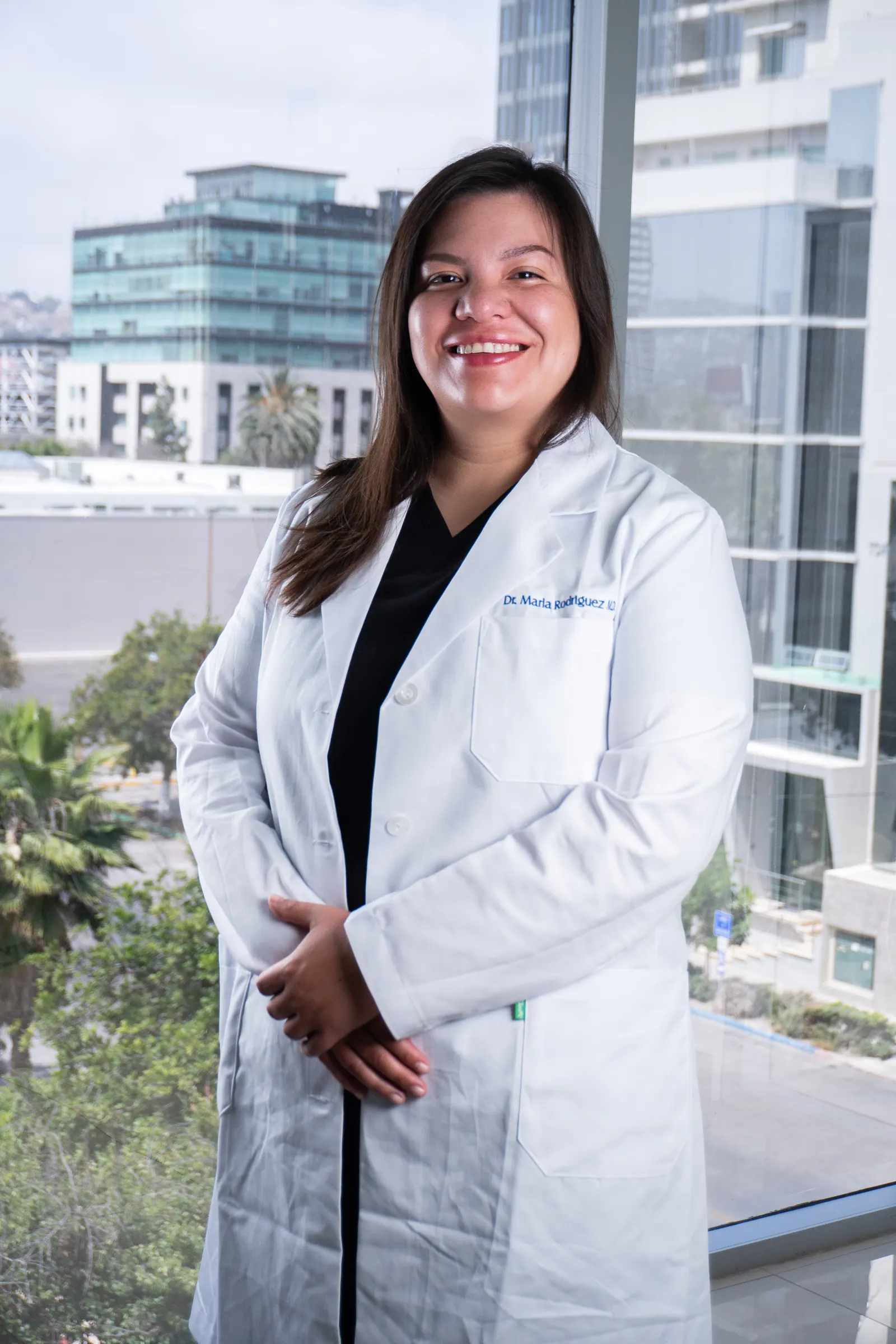 Dra. Marla Rodriguez, specialist in regenerative and integrative medicine, in a white lab coat at our partner Tijuana clinic