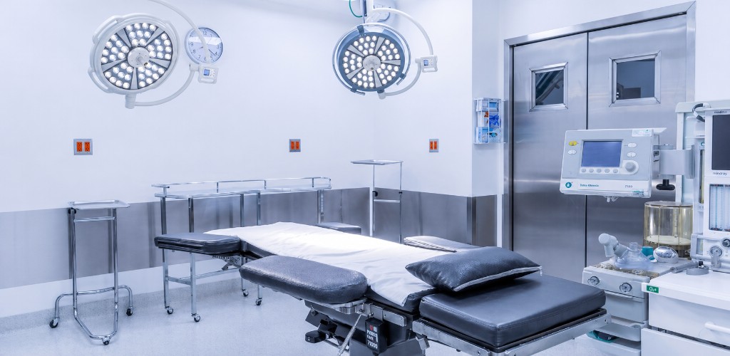 Closer view of the operating room with surgical lights and anesthesia equipment
