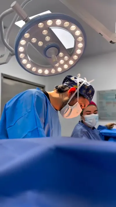 Surgical team at work under the LED lights in the operating room