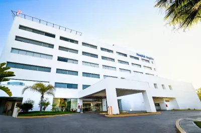 Exterior of Hospital Angeles Tijuana with its white facade and covered patient drop-off