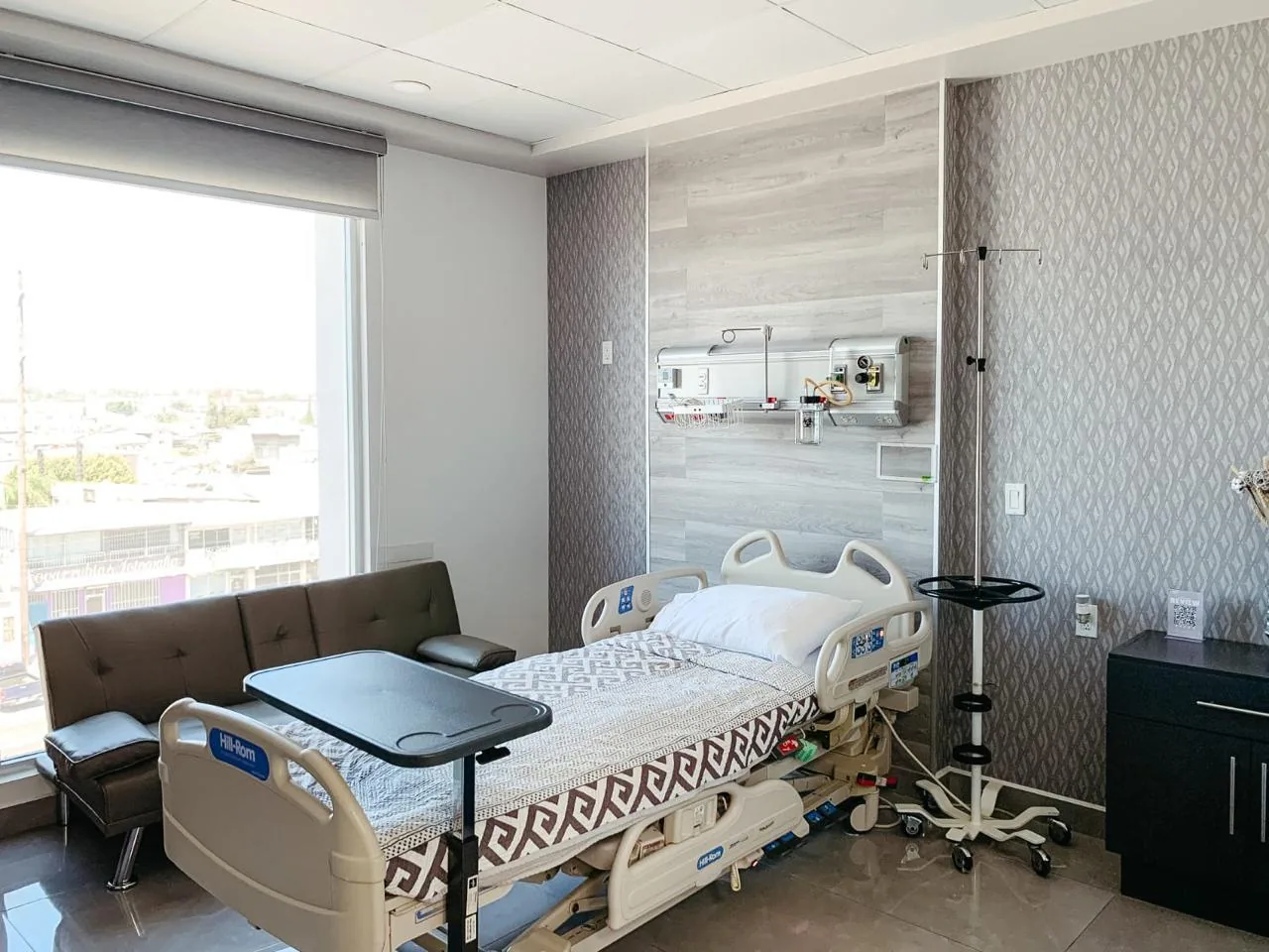 Private patient room with a window and hospital bed at a partner hospital in Tijuana