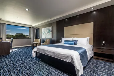 King room at Hotel Pueblo Amigo with a panoramic window and workspace