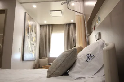Detail of a Hospital SIMNSA patient suite with soft pillows and a seating nook by the window