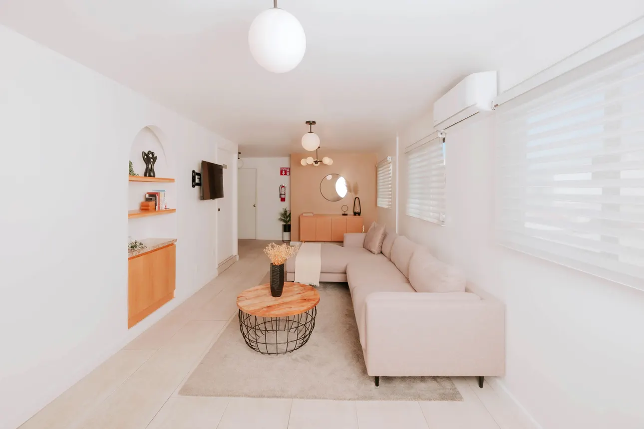 Bright common lounge with sectional sofa where patients and companions can relax